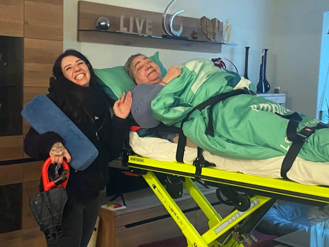 Mother on stretcher visits new home of daughter for the first and last time